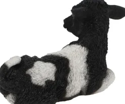 Veau noir et blanc couché en résine (Petit modèle)